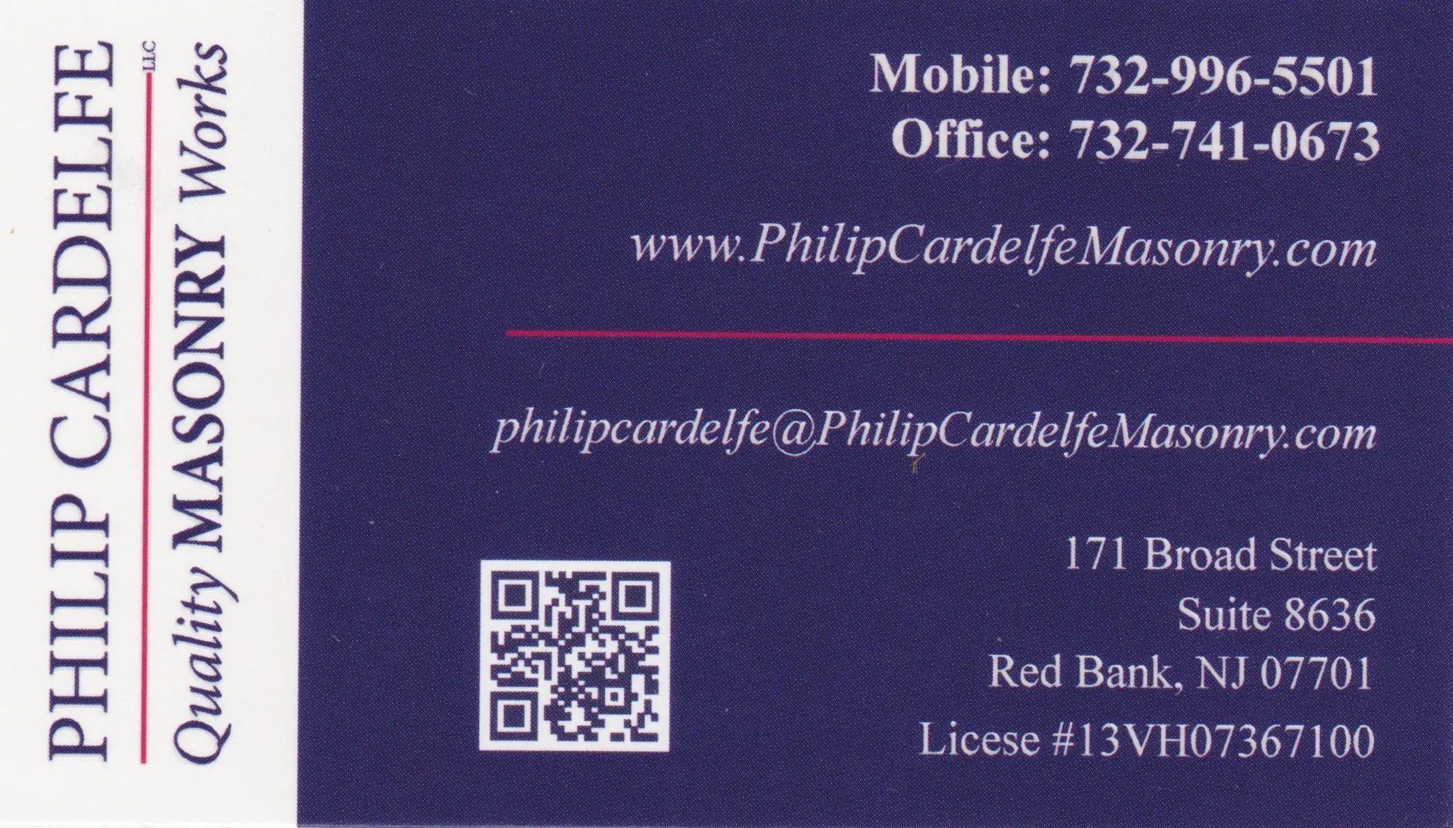 Close-up of a business card with contact details and a QR code.