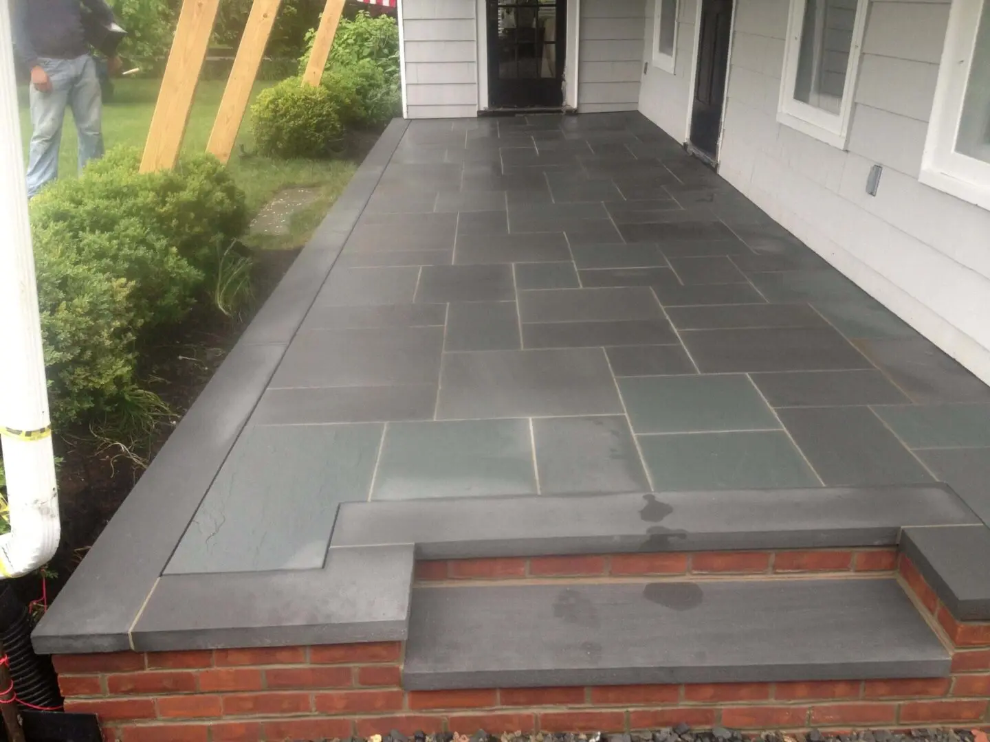 Newly installed slate patio with clean lines and modern look.