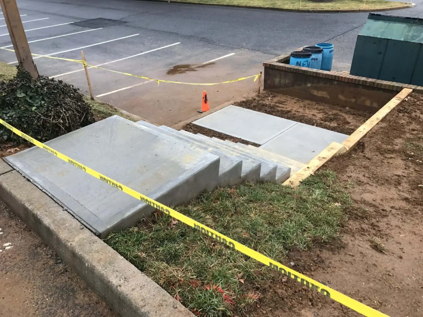 New concrete stairs with a tape measure for alignment.